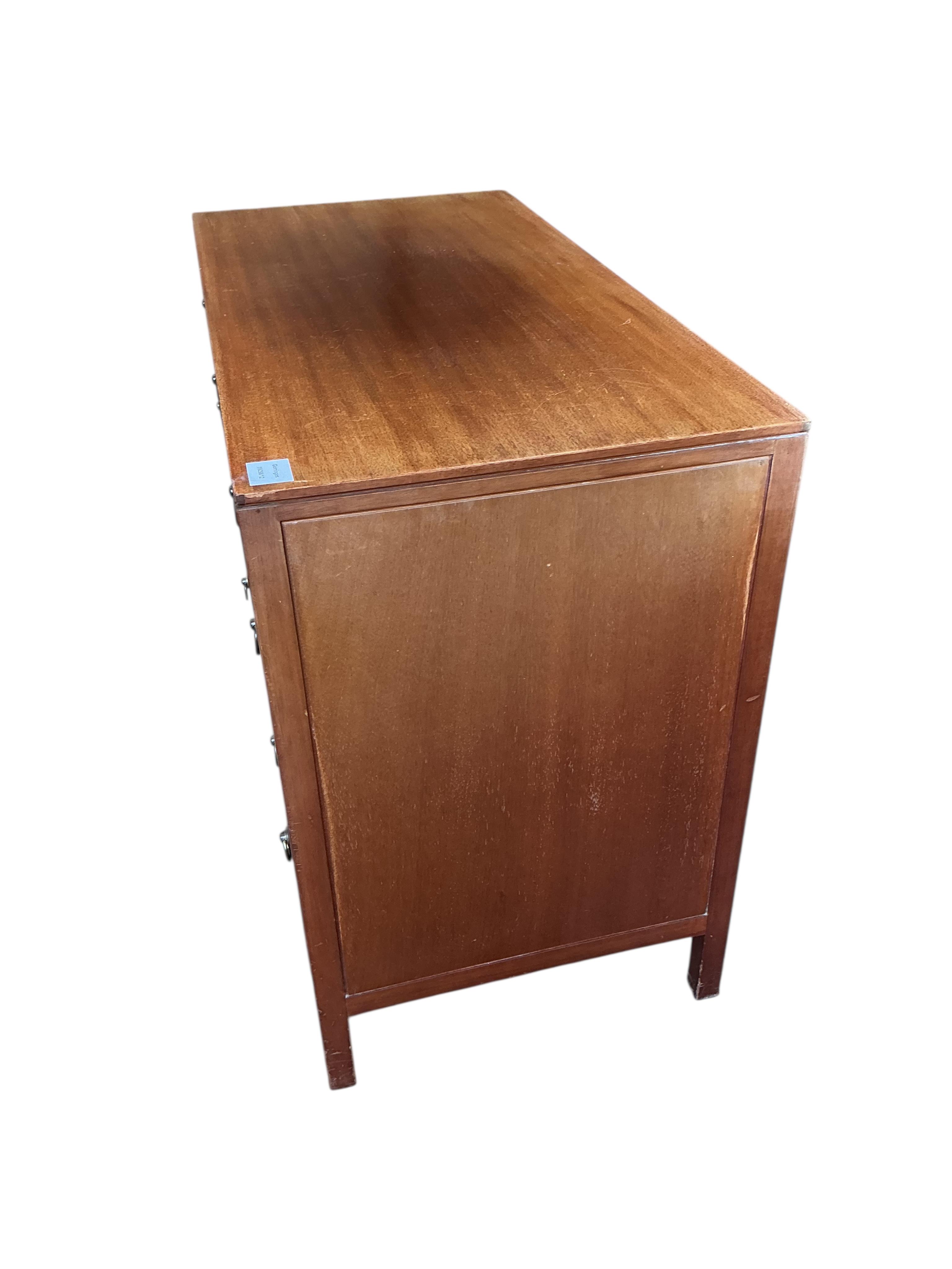 A Loughborough For Heals brass inlaid teak four piece bedroom suite comprising: triple wardrobe, width 120cm, depth 54cm, height 176cm, two chests of drawers and a toilet mirror